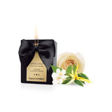 Scented massage candle. The flame of this candle reveals the meaning of the looks in the eyes of those who love each other. From the heat of its soft glow spring forth fragrances and vegetable waxes for the most sensual massages.