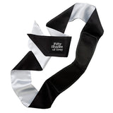  Place the satin blindfold over your lover's eyes and tie the ends tightly, adjusting the nose bridge for total blackout.